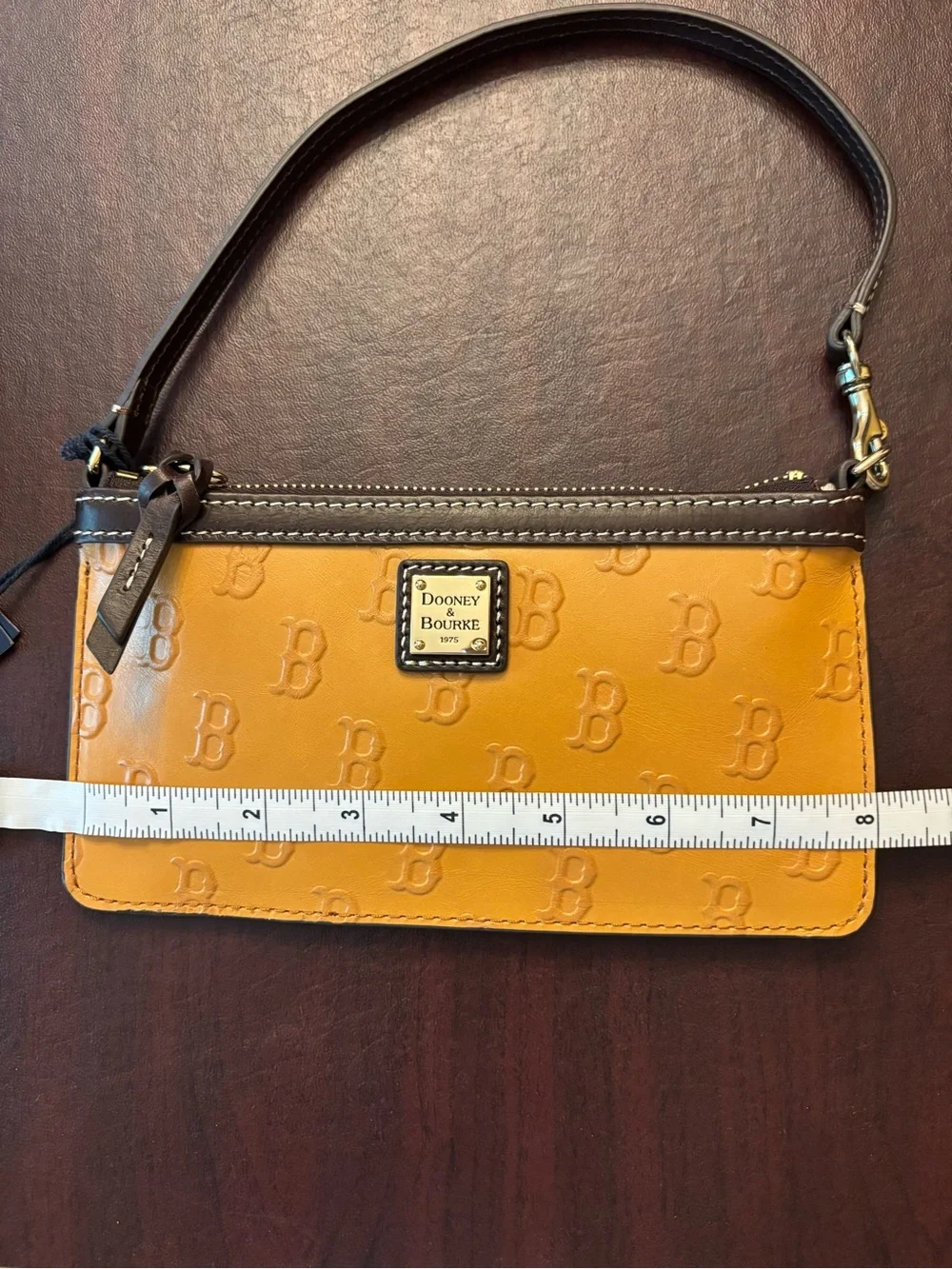 Dooney & Bourke Mustard Yellow Logo-Embossed Wristlet with Brown Trim